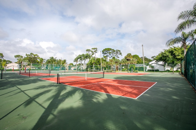 view of sport court featuring basketball hoop