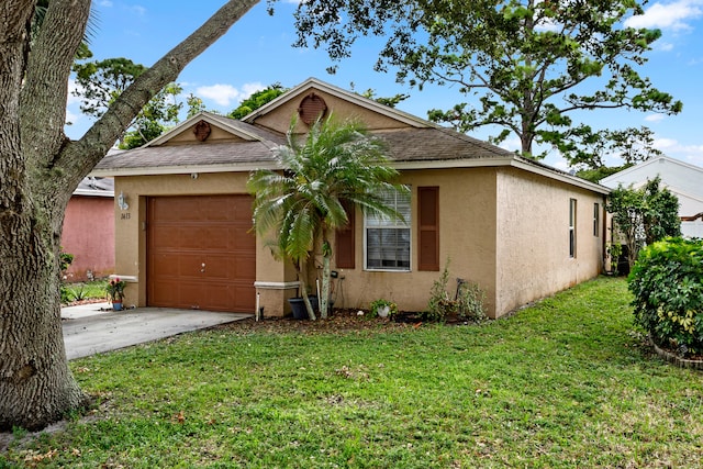 view of front of property featuring a garage and a front lawn