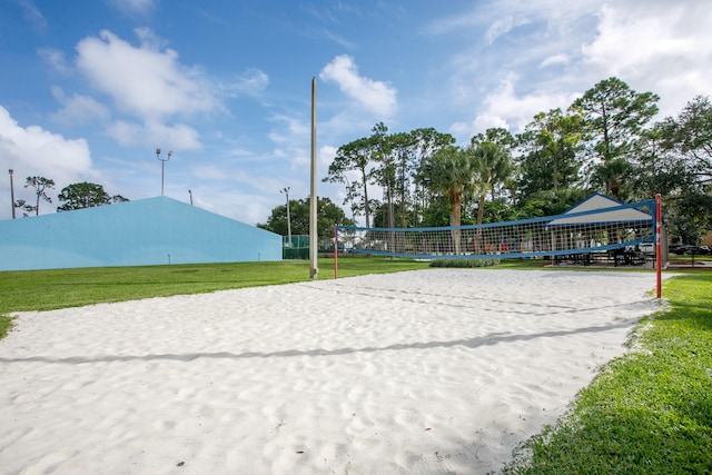 view of community featuring a lawn and volleyball court