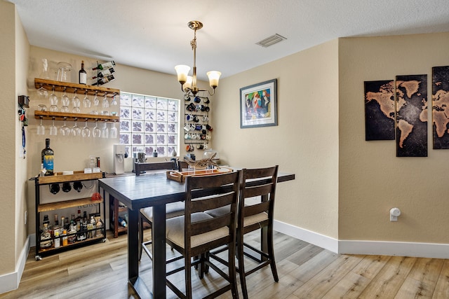 kitchen featuring kitchen peninsula, a wealth of natural light, a kitchen breakfast bar, and appliances with stainless steel finishes