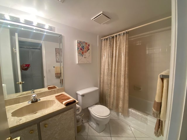 full bathroom featuring tile patterned floors, vanity, shower / bath combination with curtain, and toilet