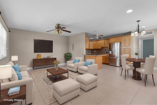 623 Monaco M, Delray Beach, FL 33446 - living room featuring light tile patterned flooring, recessed lighting, baseboards, and ceiling fan with notable chandelier