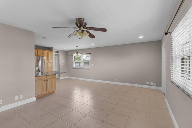 623 Monaco M, Delray Beach, FL 33446 - unfurnished room featuring recessed lighting, light tile patterned floors, visible vents, baseboards, and ceiling fan with notable chandelier