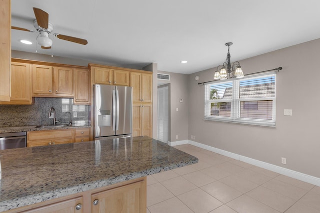 623 Monaco M, Delray Beach, FL 33446 - kitchen featuring tasteful backsplash, a sink, appliances with stainless steel finishes, visible vents, and baseboards