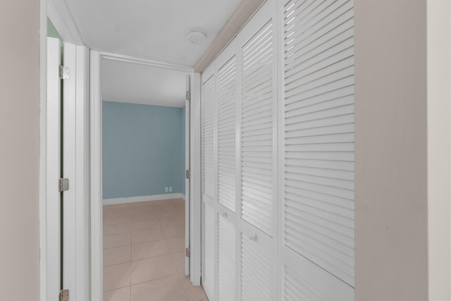 623 Monaco M, Delray Beach, FL 33446 - corridor featuring light tile patterned flooring and baseboards