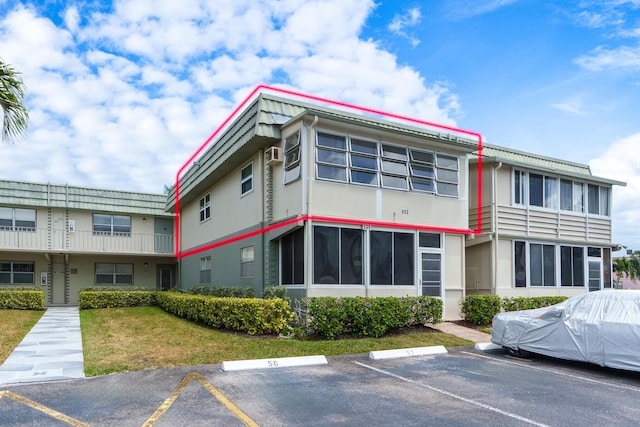 623 Monaco M, Delray Beach, FL 33446 - view of property with uncovered parking