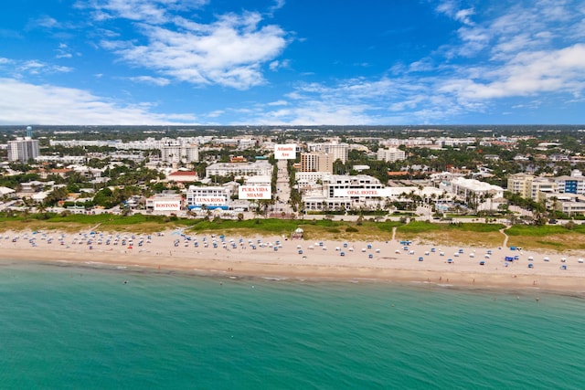 drone / aerial view with a view of the beach and a water view