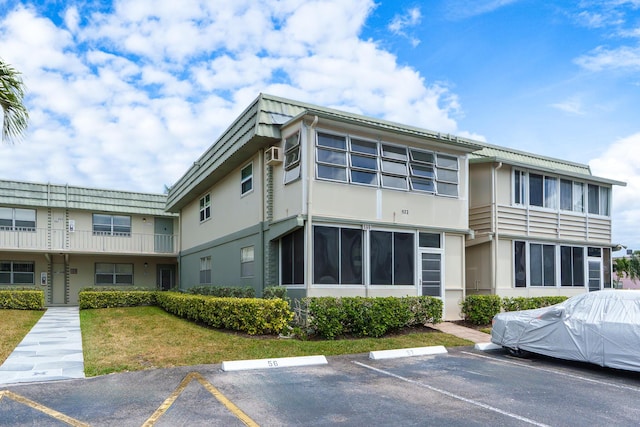 623 Monaco M, Delray Beach, FL 33446 - view of building exterior with uncovered parking