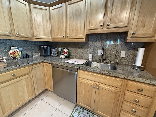 kitchen featuring backsplash, sink, light tile patterned flooring, and stainless steel dishwasher