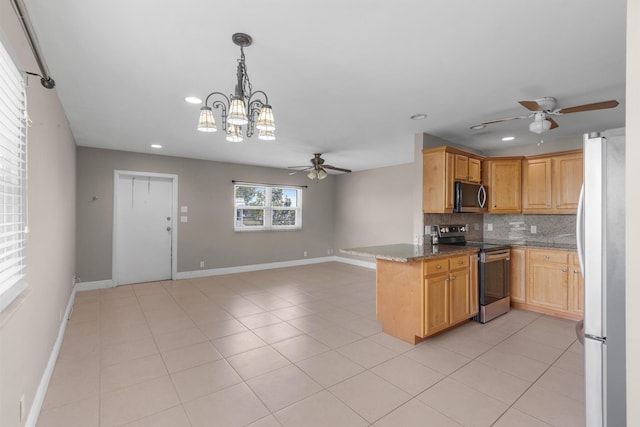 623 Monaco M, Delray Beach, FL 33446 - kitchen featuring recessed lighting, stainless steel appliances, ceiling fan with notable chandelier, backsplash, and light tile patterned flooring