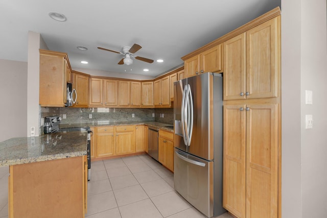 623 Monaco M, Delray Beach, FL 33446 - kitchen featuring recessed lighting, decorative backsplash, ceiling fan, stone countertops, and appliances with stainless steel finishes