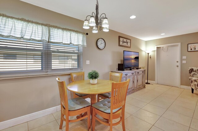 kitchen featuring backsplash, ceiling fan, light stone countertops, light tile patterned floors, and stainless steel appliances