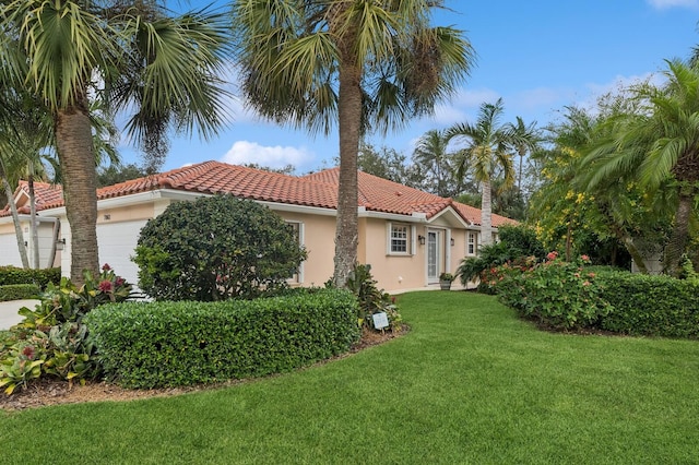 view of side of home with a lawn and a garage