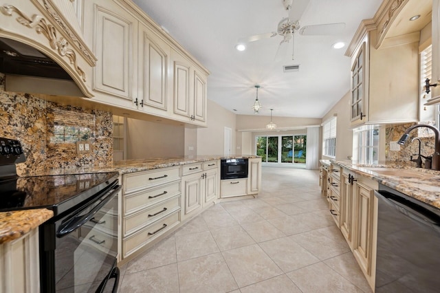 kitchen with black appliances, sink, vaulted ceiling, light stone countertops, and light tile patterned flooring