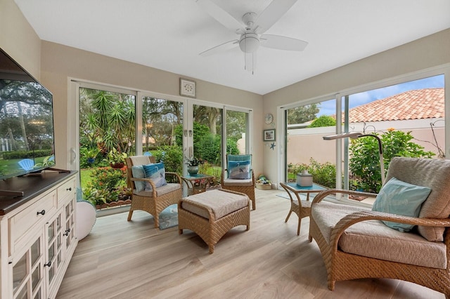 sunroom featuring ceiling fan