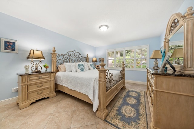 bedroom featuring light tile patterned flooring