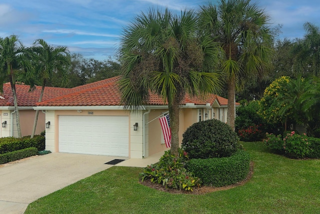 view of front facade featuring a garage and a front lawn