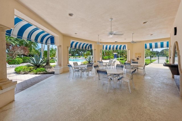 view of patio / terrace featuring ceiling fan and a community pool