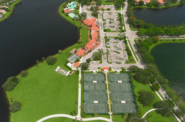 birds eye view of property with a water view