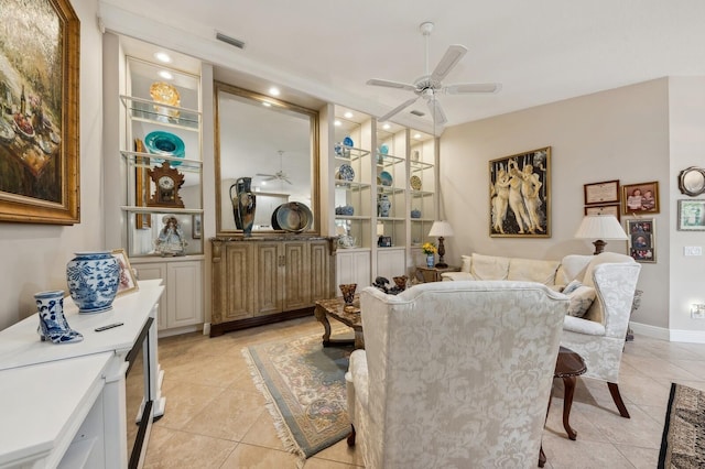 tiled dining room featuring ceiling fan