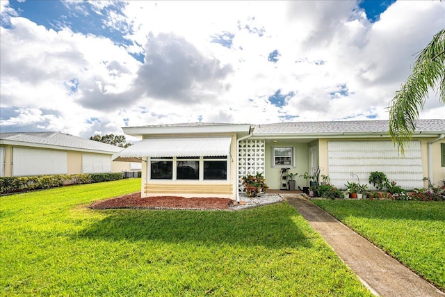 909 Savannas Point Dr Unit A, Fort Pierce, FL 34982 - back of property with a yard and stucco siding