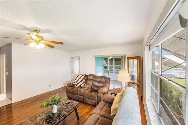 909 Savannas Point Dr Unit A, Fort Pierce, FL 34982 - living room with wood finished floors, a ceiling fan, and a textured ceiling