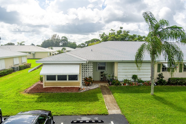 single story home featuring a front yard