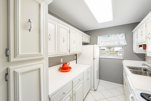 kitchen with white cabinetry, white appliances, sink, and light tile patterned floors