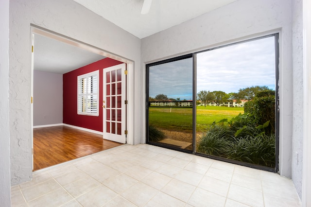 interior space with ceiling fan and light hardwood / wood-style floors