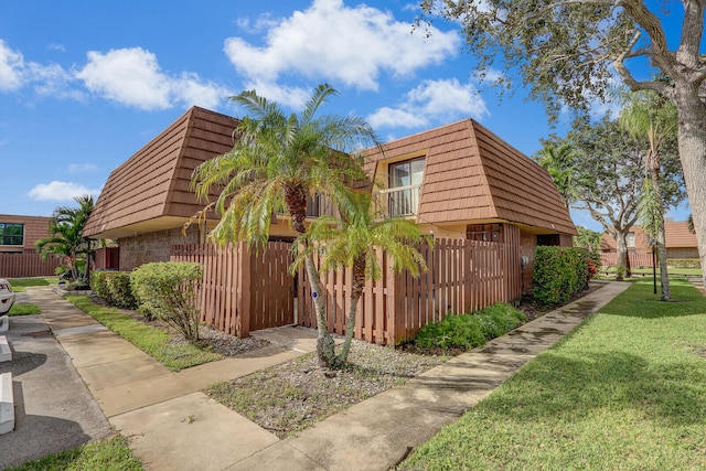 view of property exterior with a yard