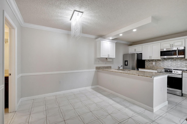 kitchen with kitchen peninsula, backsplash, a textured ceiling, stainless steel appliances, and white cabinets