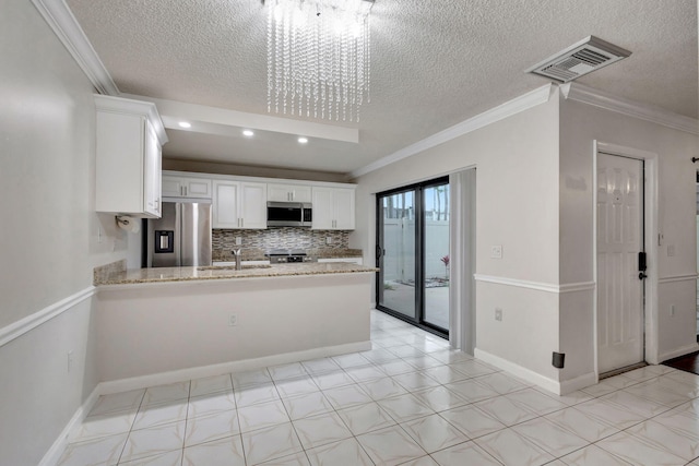 kitchen with kitchen peninsula, white cabinetry, stainless steel appliances, and an inviting chandelier