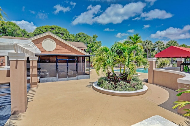 view of home's community with a patio and a pool