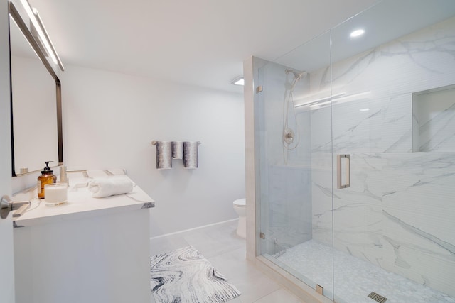 bathroom featuring tile patterned flooring, vanity, toilet, and a shower with door