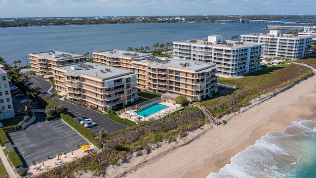 bird's eye view with a view of the beach and a water view