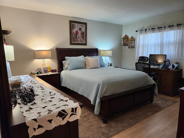 bedroom with light hardwood / wood-style flooring