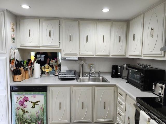 kitchen featuring white cabinetry, sink, and appliances with stainless steel finishes