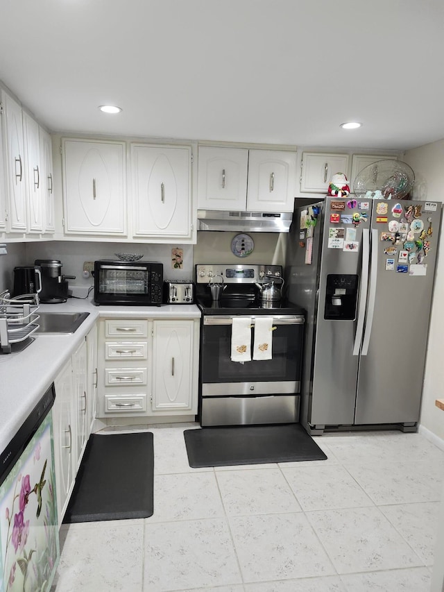 kitchen featuring light tile patterned flooring, white cabinets, and stainless steel appliances