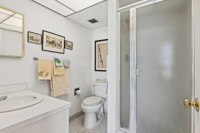 bathroom with toilet, a shower with door, vanity, and tile patterned flooring