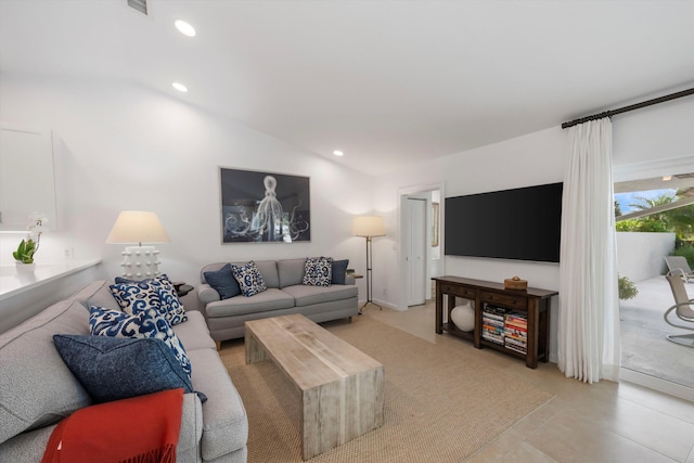 tiled living room with lofted ceiling