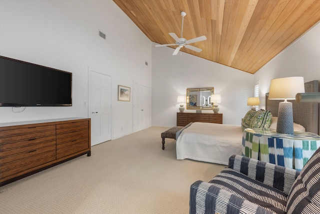 bedroom featuring carpet, ceiling fan, wood ceiling, and high vaulted ceiling