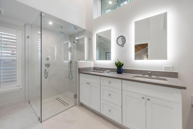 bathroom with a towering ceiling, vanity, and an enclosed shower