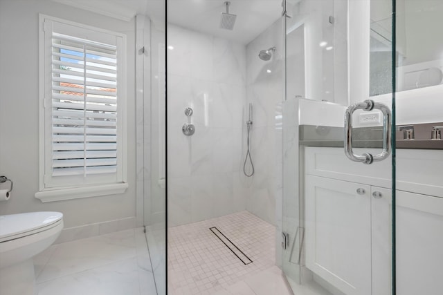 bathroom featuring toilet and a shower with door