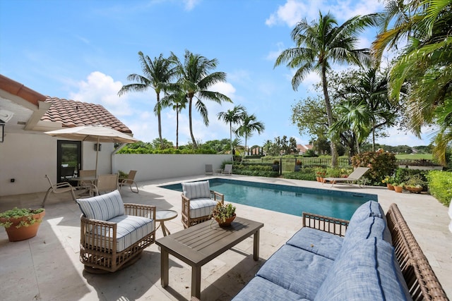 view of swimming pool featuring a patio area