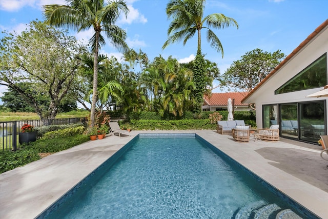 view of swimming pool featuring an outdoor hangout area and a patio area