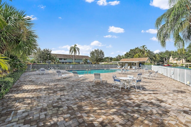 view of swimming pool with a patio