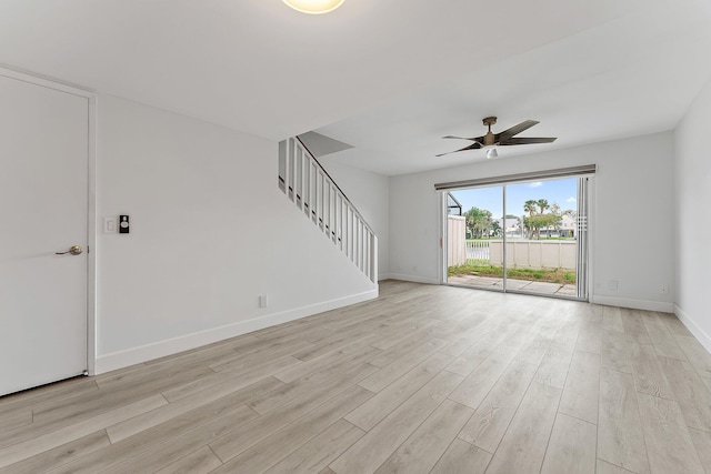 spare room with light hardwood / wood-style floors and ceiling fan