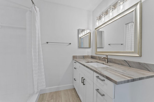 bathroom featuring vanity and hardwood / wood-style flooring