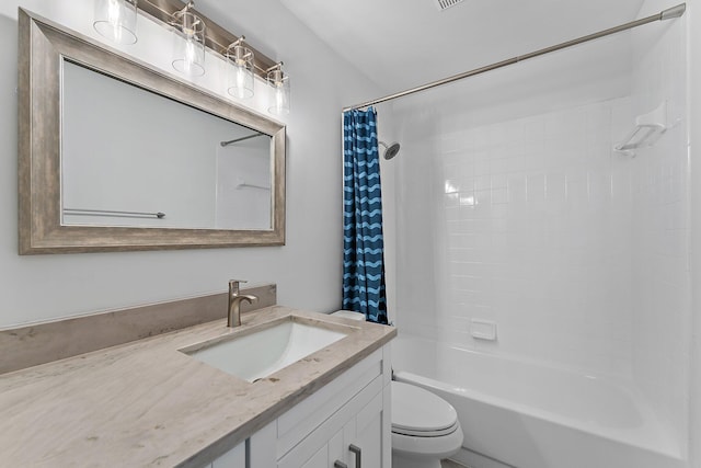 full bathroom featuring shower / bath combo, vanity, and toilet