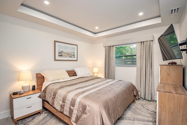 bedroom with a raised ceiling